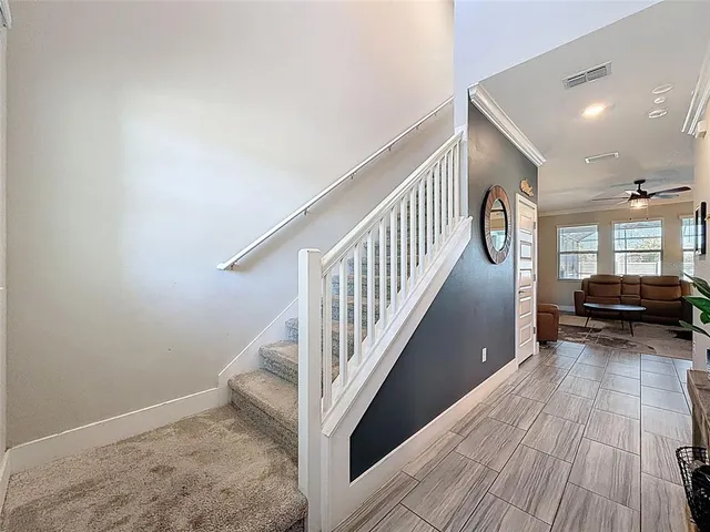 a bedroom with bed and a chandelier