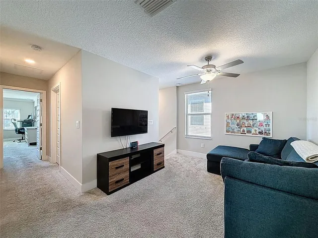a bathroom with a toilet sink vanity and mirror
