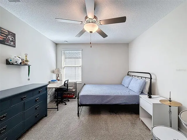 an aerial view of a house with a ocean view