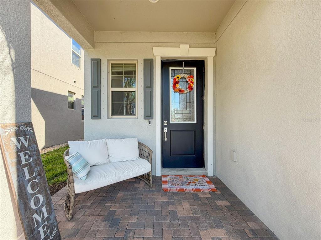 8124 Olympic Stone Circle Trinity, FL 34655 - Photo 6 of 75 a living room with furniture and a window