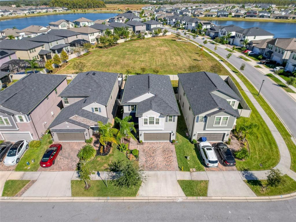 8124 Olympic Stone Circle Trinity, FL 34655 - Photo 68 of 75 an aerial view of residential houses with outdoor space