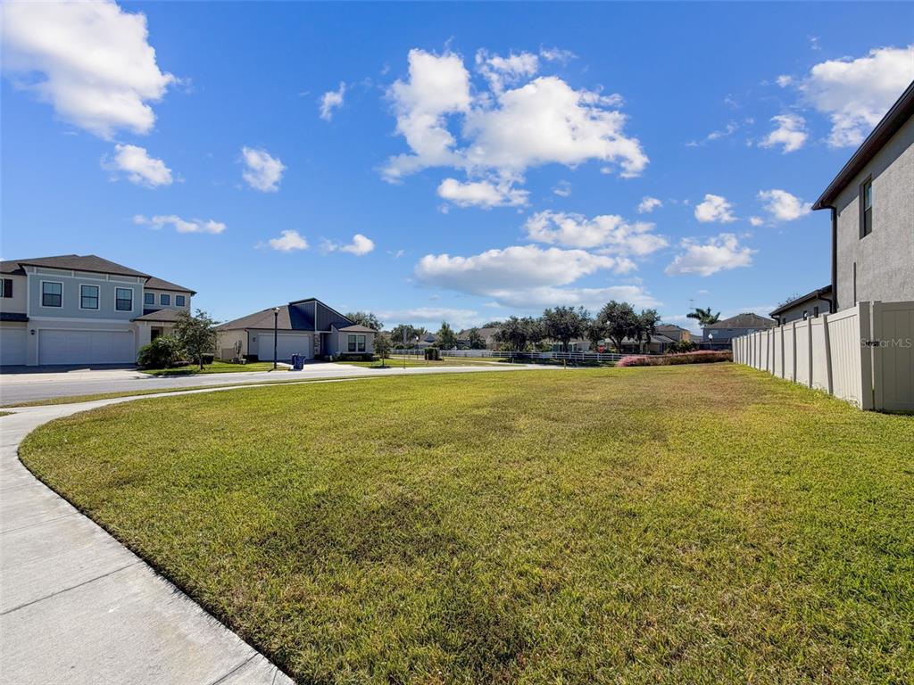8124 Olympic Stone Circle Trinity, FL 34655 - Photo 69 of 75 a view of a fountain in front of a house with a yard