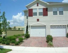 5989 Strada Capri Way Orlando, FL 32835 - Photo 1 of 1 a view of a house with a yard and balcony