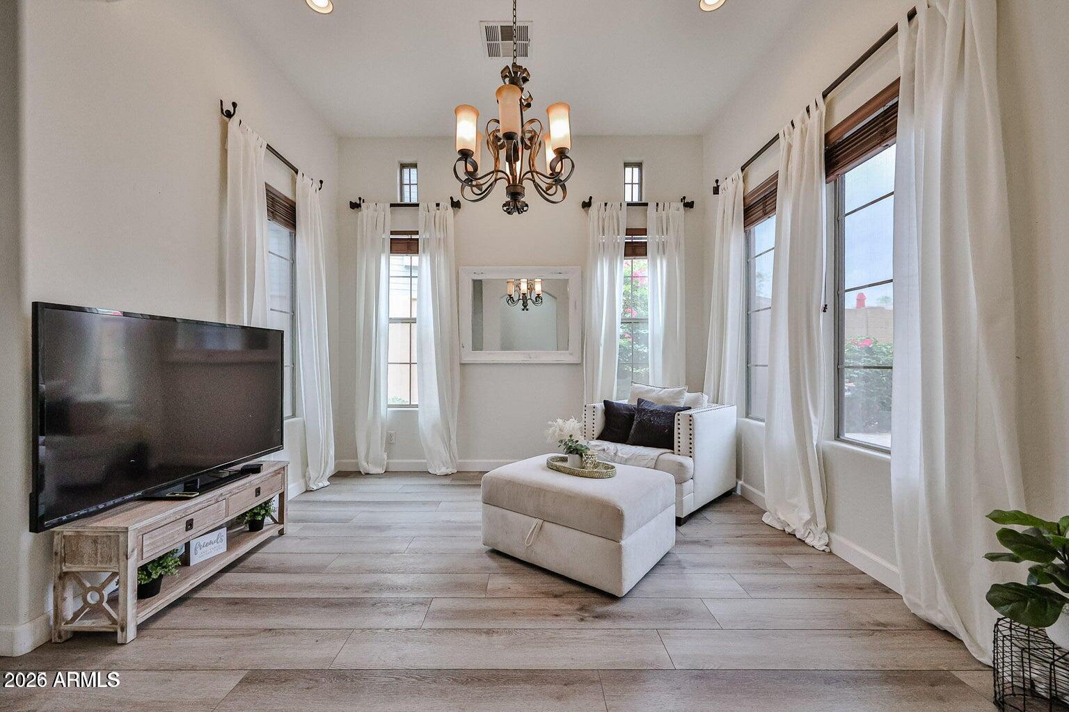3950 North Edith Way Buckeye, AZ 85396 - Photo 7 of 32 a living room with furniture and a flat screen tv