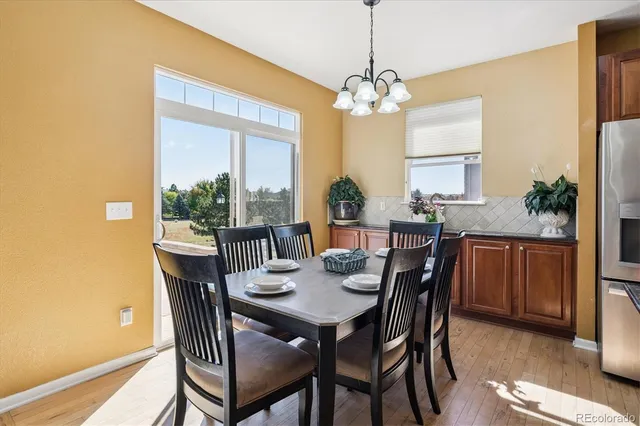 a bedroom with a bed chair and a desk