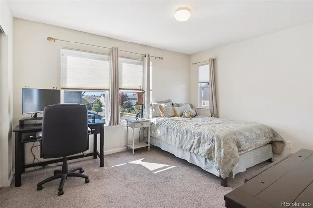 a view of a house with sitting area and a yard