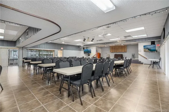a large kitchen with stainless steel appliances granite countertop a stove and a sink
