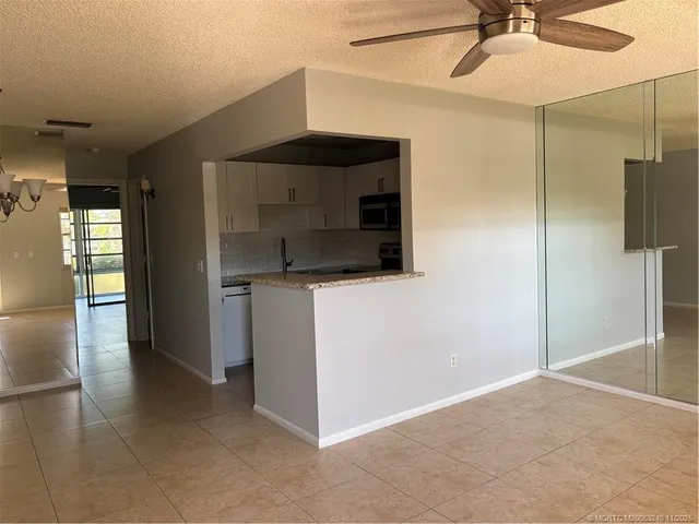 a bathroom with a shower and a sink