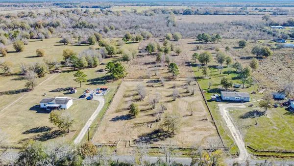 an aerial view of residential house with outdoor space