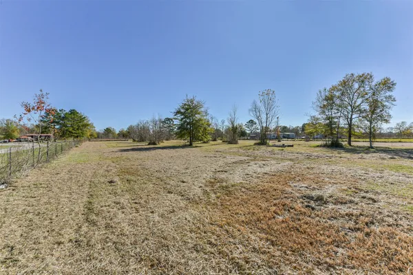 a view of a lake with houses in the background