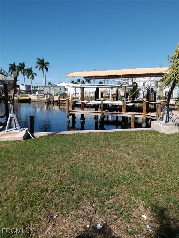 a view of a yard with a table and chairs