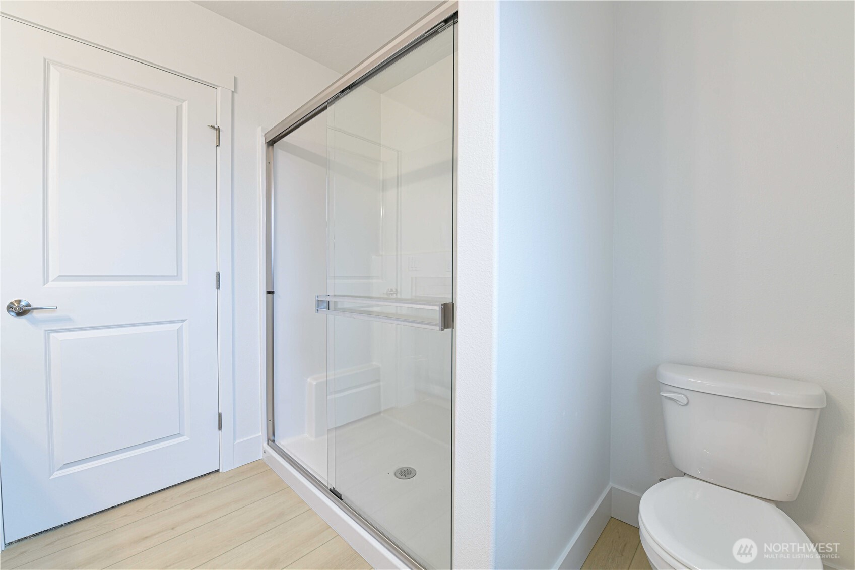 4259 Sandy Street Moses Lake, WA 98837 - Photo 11 of 21 a white toilet sitting next to a bathroom