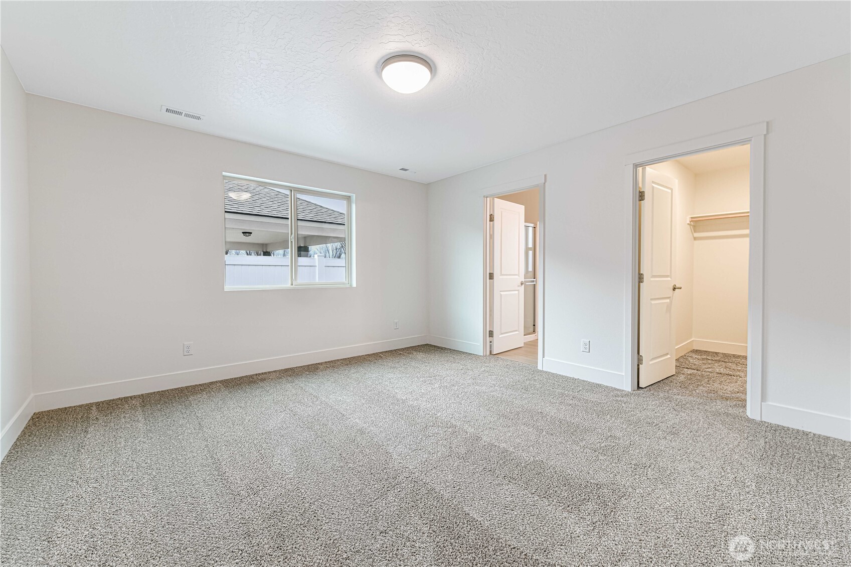 4259 Sandy Street Moses Lake, WA 98837 - Photo 14 of 21 an empty room with windows and closet