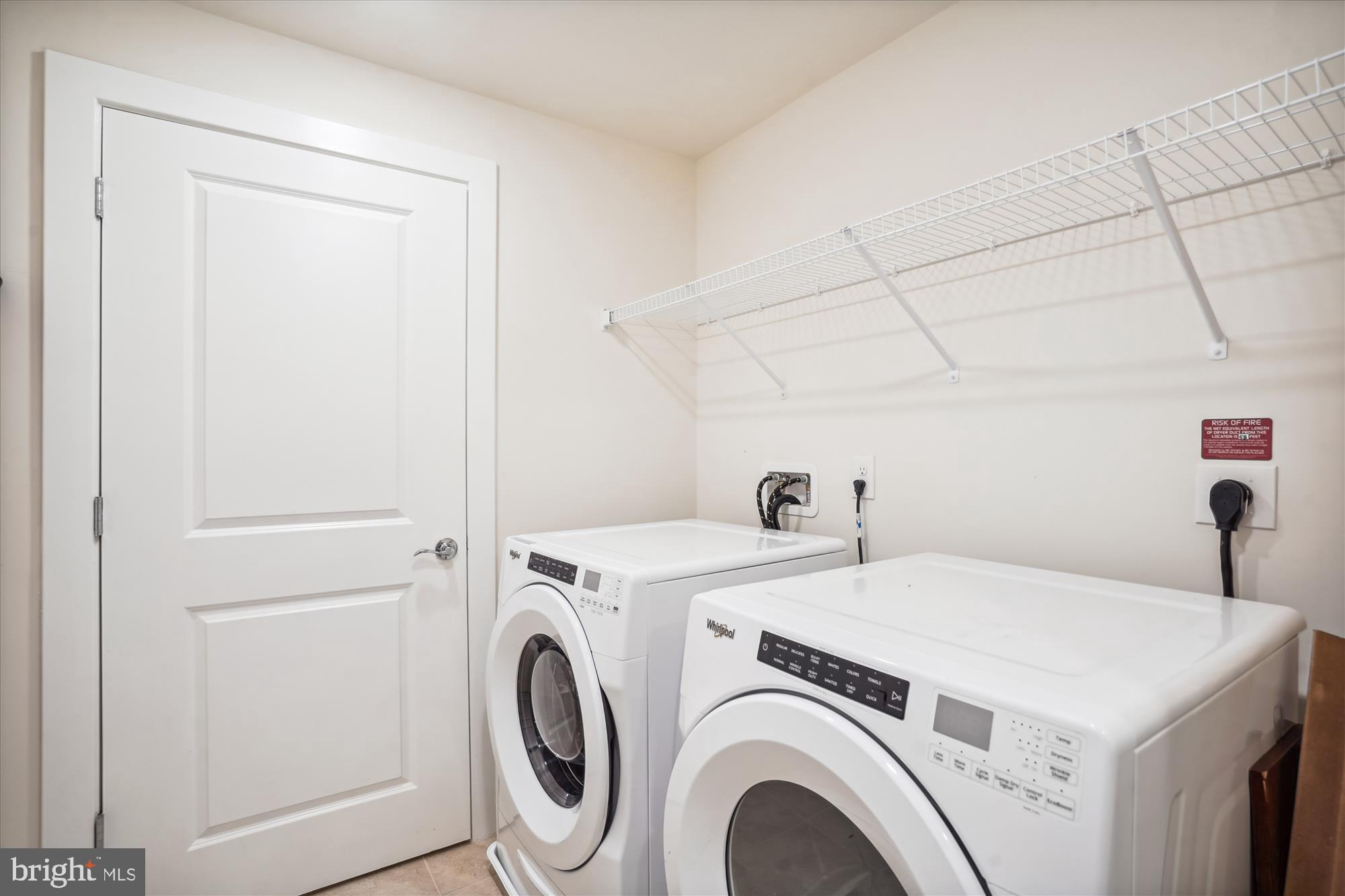 11200 Reston Station Boulevard, Unit 306 Reston, VA 20190 - Photo 20 of 53 a utility room with dryer and washer