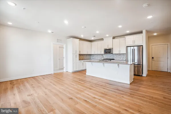 a view of kitchen with wooden floor