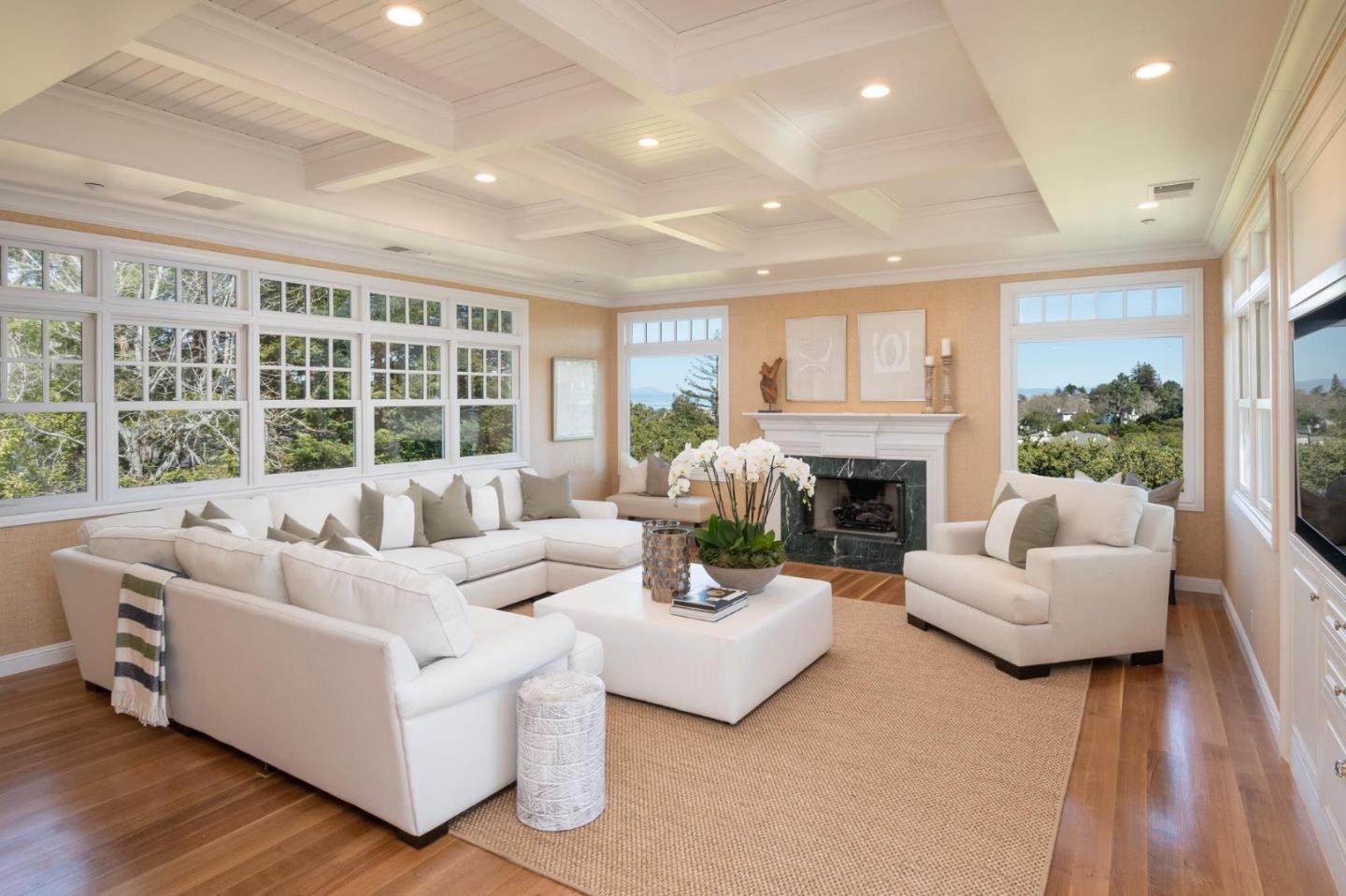 130 Ridgeway Road Hillsborough, CA 94010 - Photo 16 of 38 a living room with furniture and a fireplace