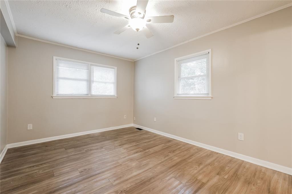 2965 Judylyn Drive Decatur, GA 30033 - Photo 13 of 26 a view of an empty room with wooden floor and a window