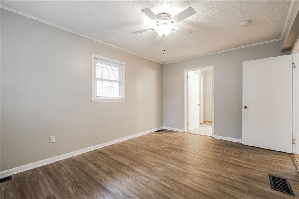 2965 Judylyn Drive Decatur, GA 30033 - Photo 14 of 26 a view of an empty room with wooden floor and a window