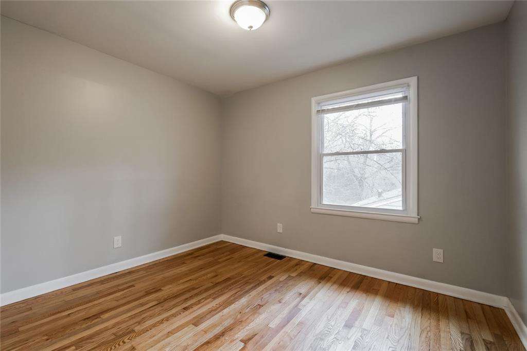 2965 Judylyn Drive Decatur, GA 30033 - Photo 16 of 26 an empty room with wooden floor and windows