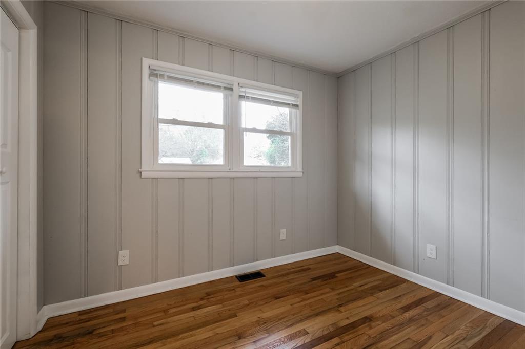 2965 Judylyn Drive Decatur, GA 30033 - Photo 22 of 26 an empty room with wooden floor and windows