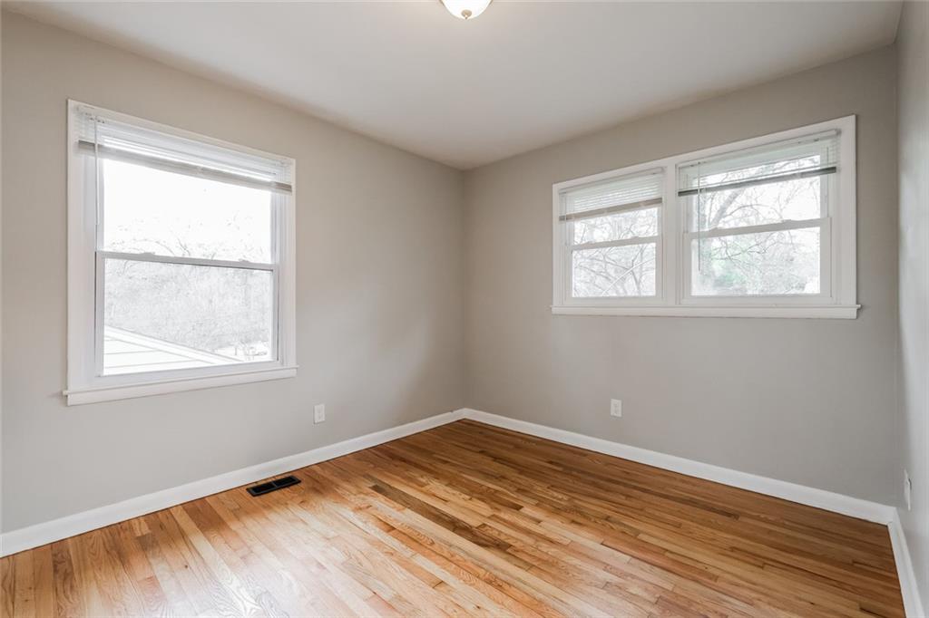 2965 Judylyn Drive Decatur, GA 30033 - Photo 24 of 26 a view of an empty room with wooden floor and a window