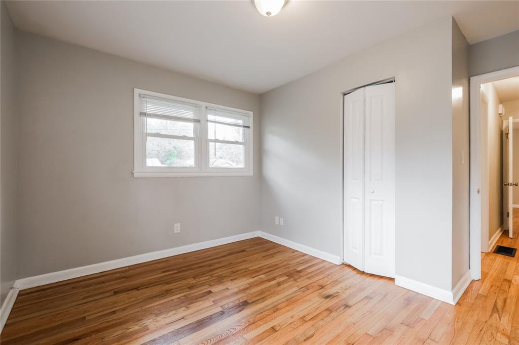 2965 Judylyn Drive Decatur, GA 30033 - Photo 25 of 26 a view of empty room with wooden floor and fan