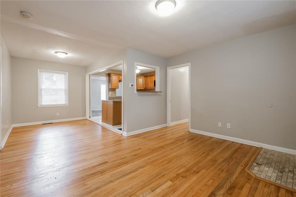 2965 Judylyn Drive Decatur, GA 30033 - Photo 4 of 26 an empty room with wooden floor and windows