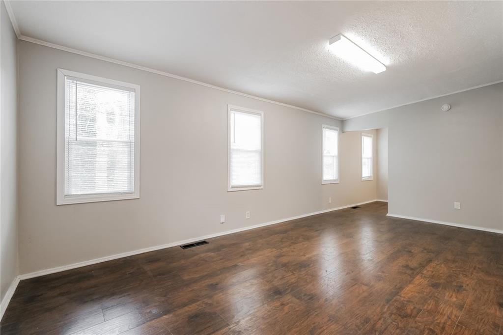 2965 Judylyn Drive Decatur, GA 30033 - Photo 10 of 26 a view of an empty room with wooden floor and a window