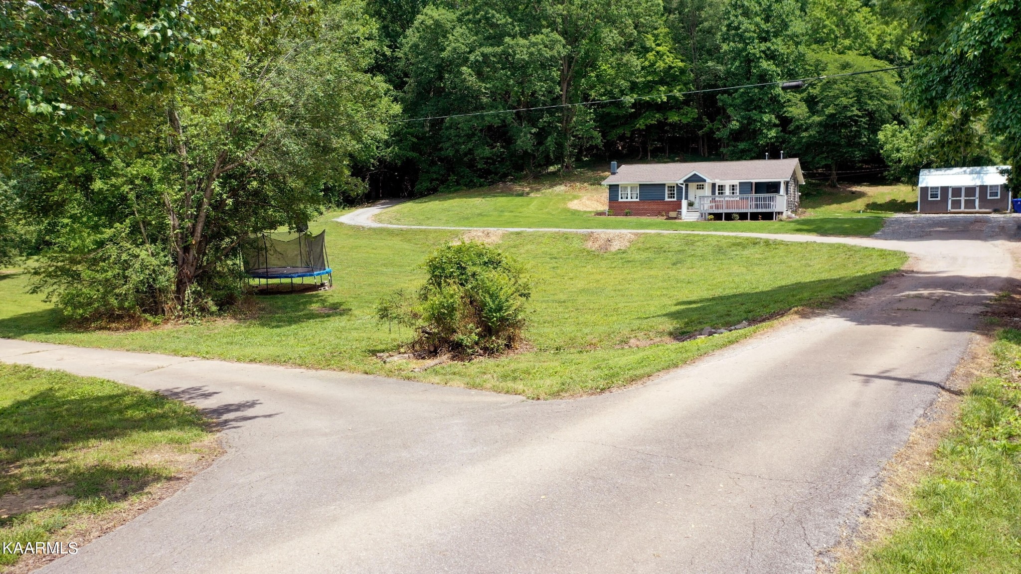 679 Blockhouse Valley Road Clinton, TN 37716 - Photo 11 of 45 a view of a swimming pool with a patio