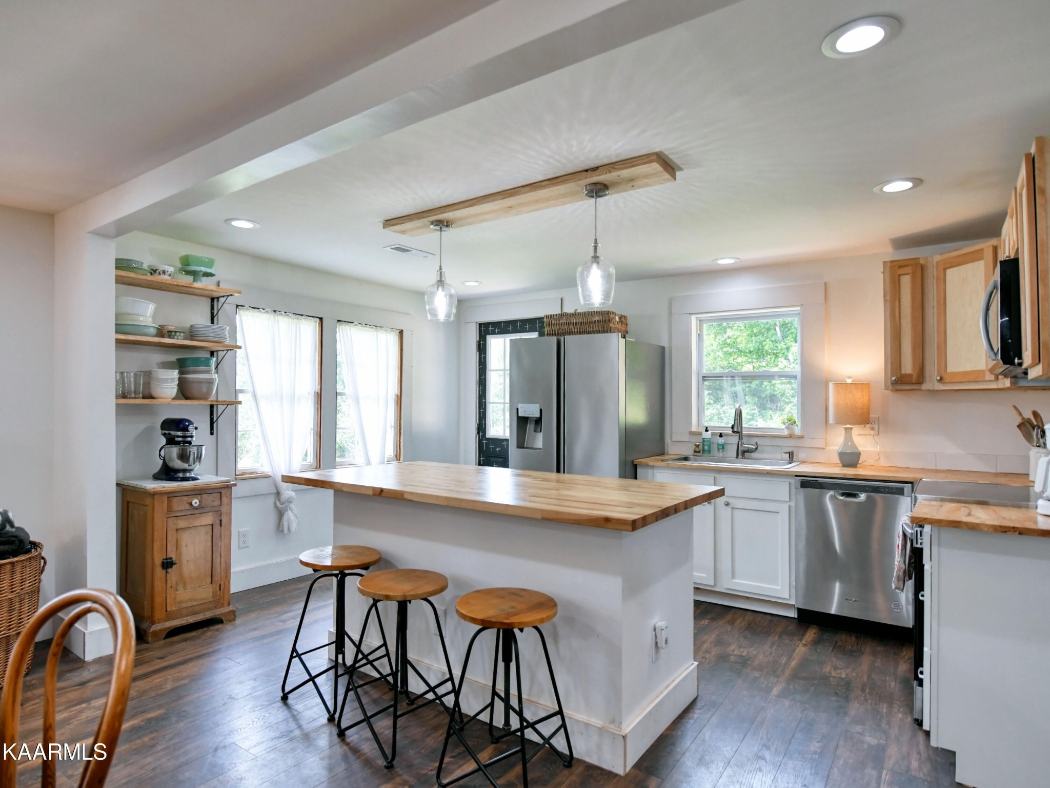 679 Blockhouse Valley Road Clinton, TN 37716 - Photo 14 of 45 a large kitchen with kitchen island a dining table chairs and wooden floor