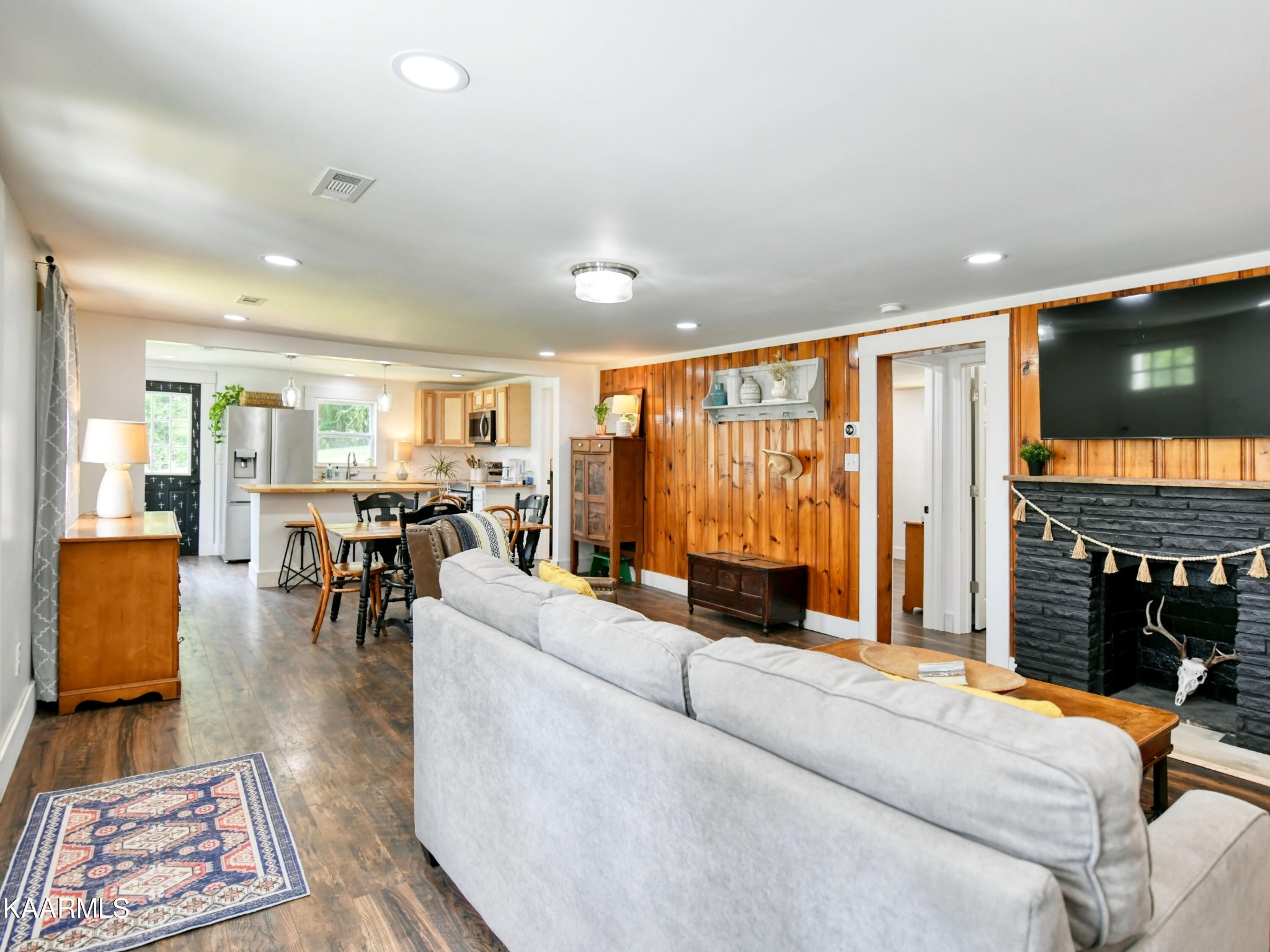679 Blockhouse Valley Road Clinton, TN 37716 - Photo 26 of 45 a living room with furniture a rug and a large window