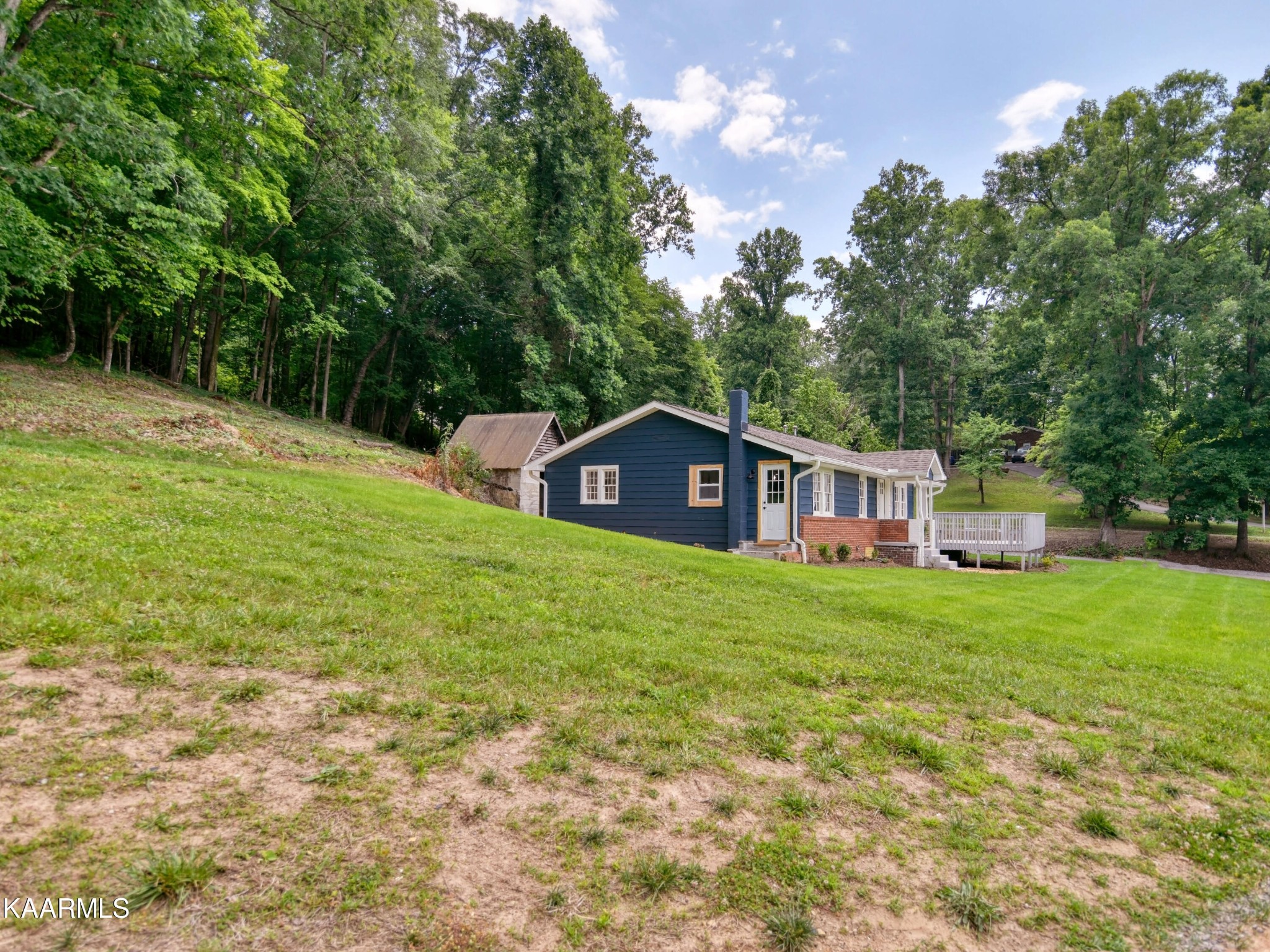 679 Blockhouse Valley Road Clinton, TN 37716 - Photo 35 of 45 a view of a house with a backyard