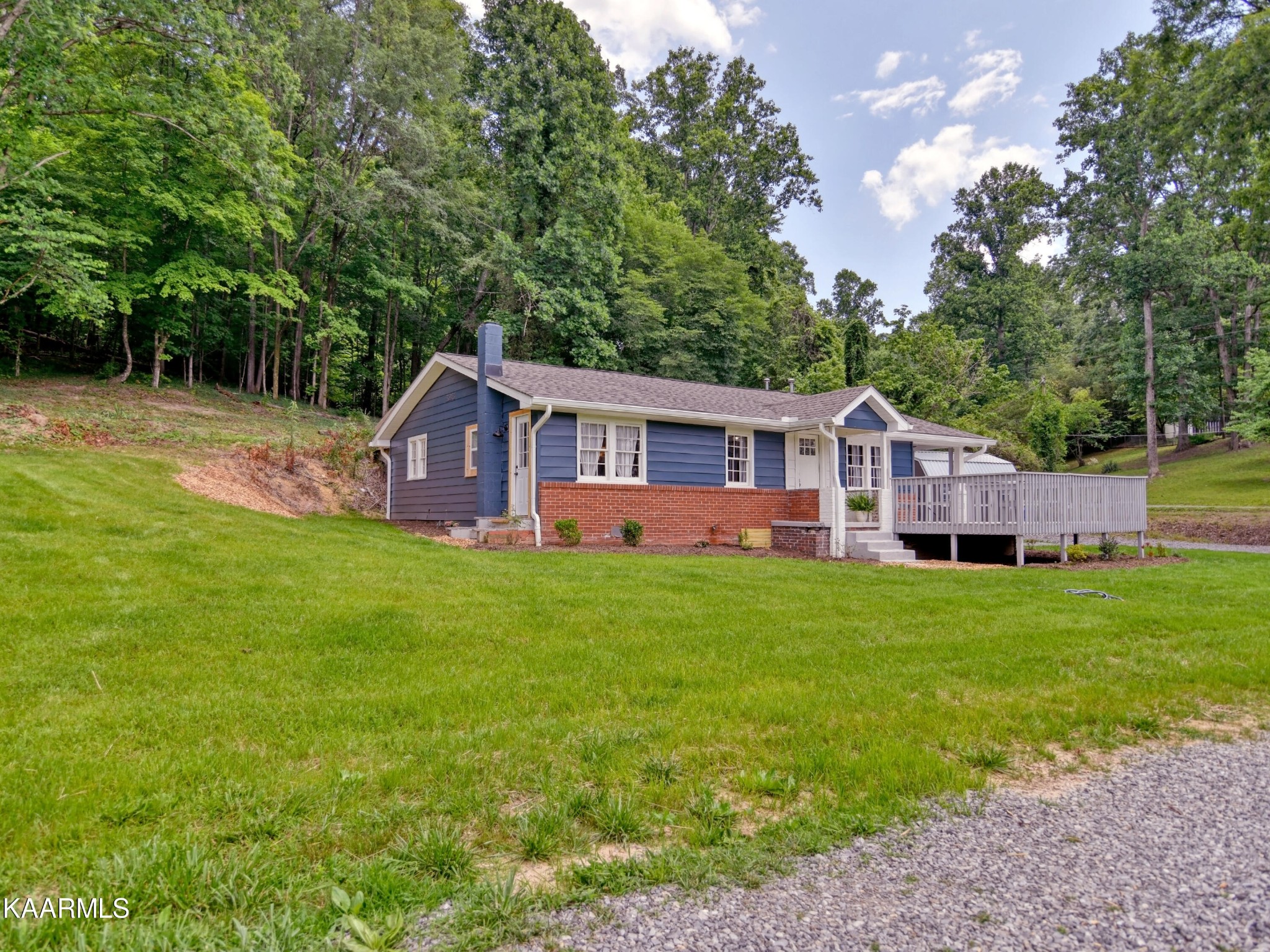 679 Blockhouse Valley Road Clinton, TN 37716 - Photo 36 of 45 a view of a house with backyard and sitting area