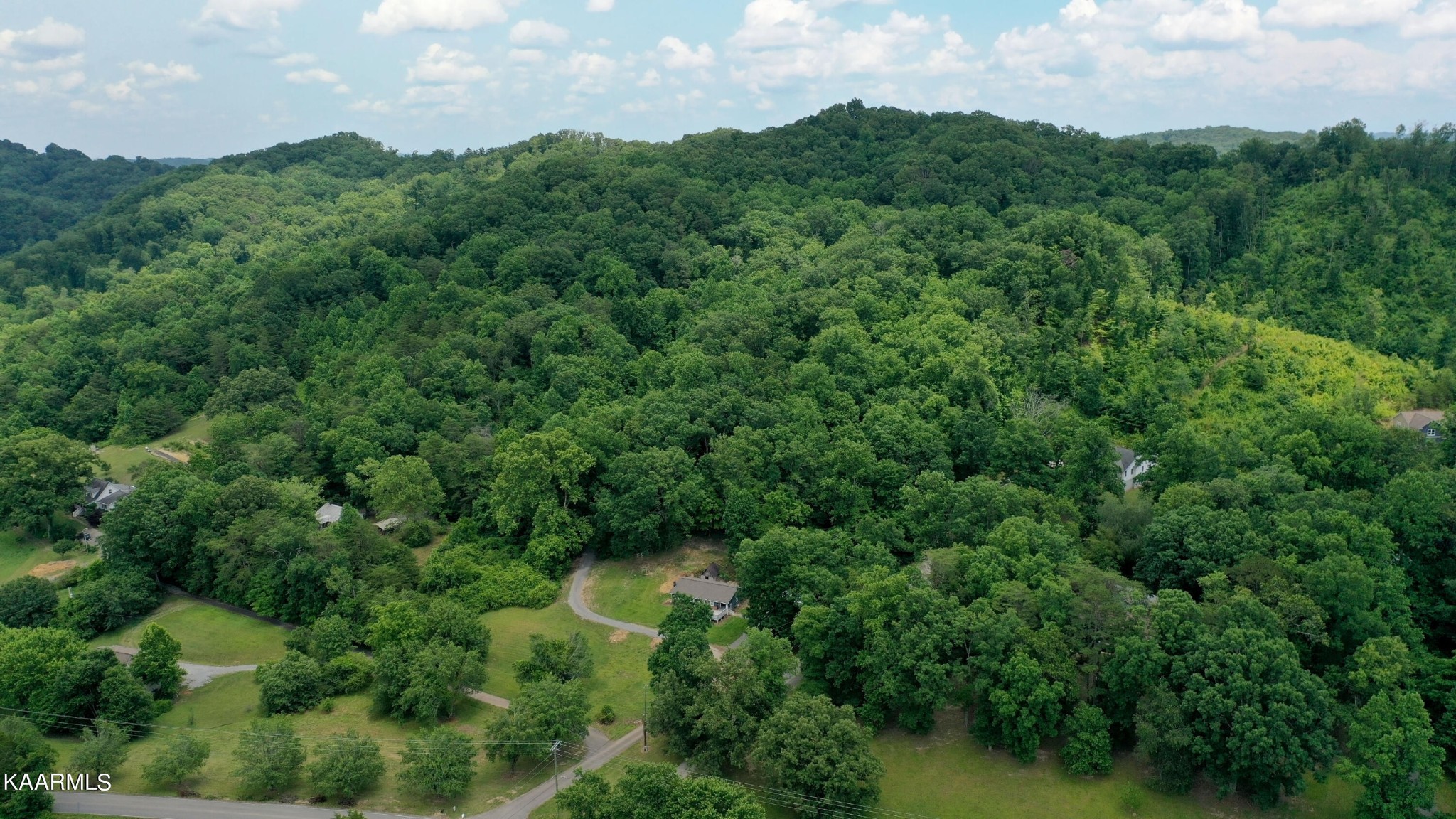679 Blockhouse Valley Road Clinton, TN 37716 - Photo 39 of 45 an aerial view of a houses with a yard