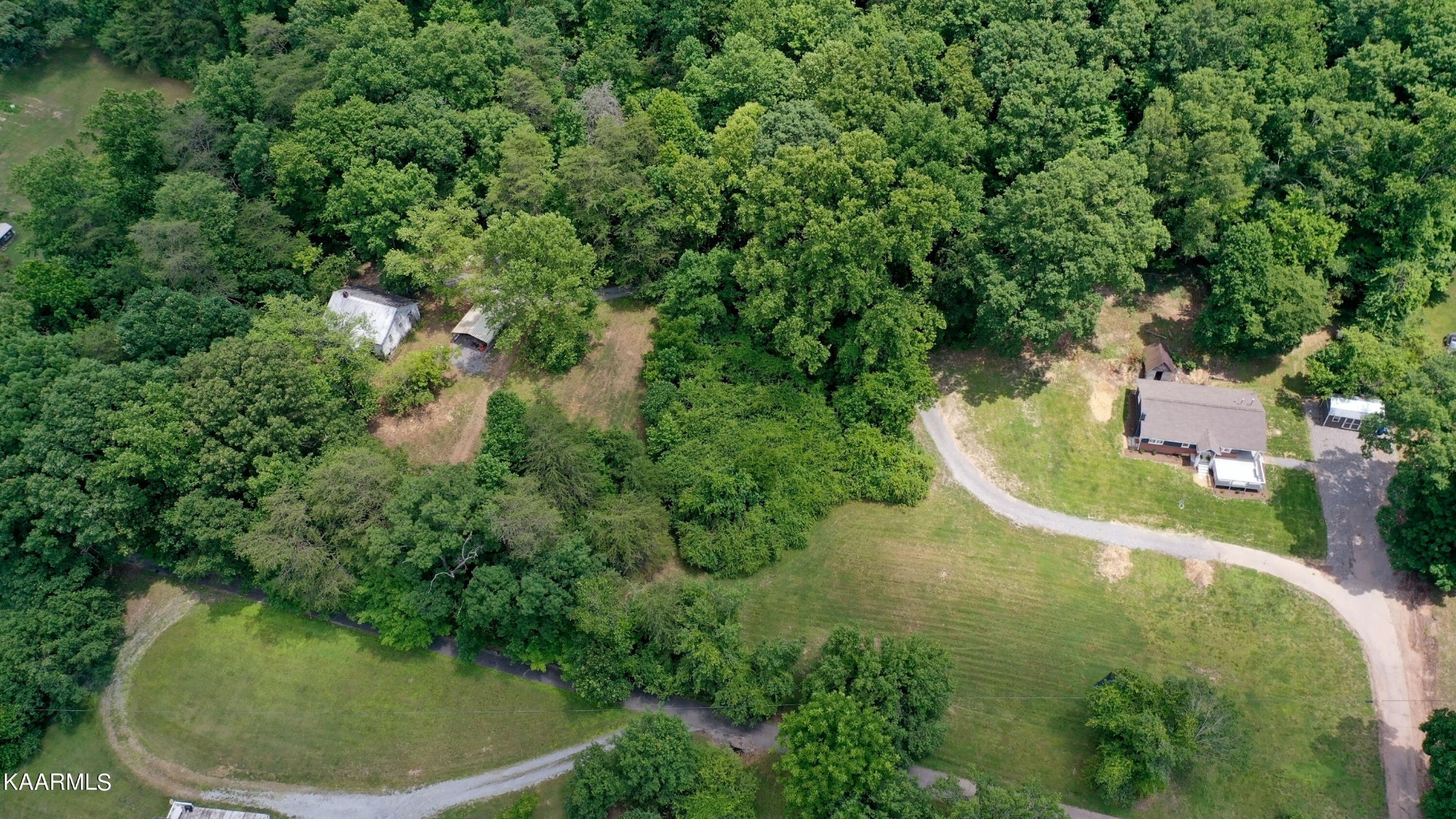 679 Blockhouse Valley Road Clinton, TN 37716 - Photo 43 of 45 an aerial view of residential house with outdoor space and trees all around