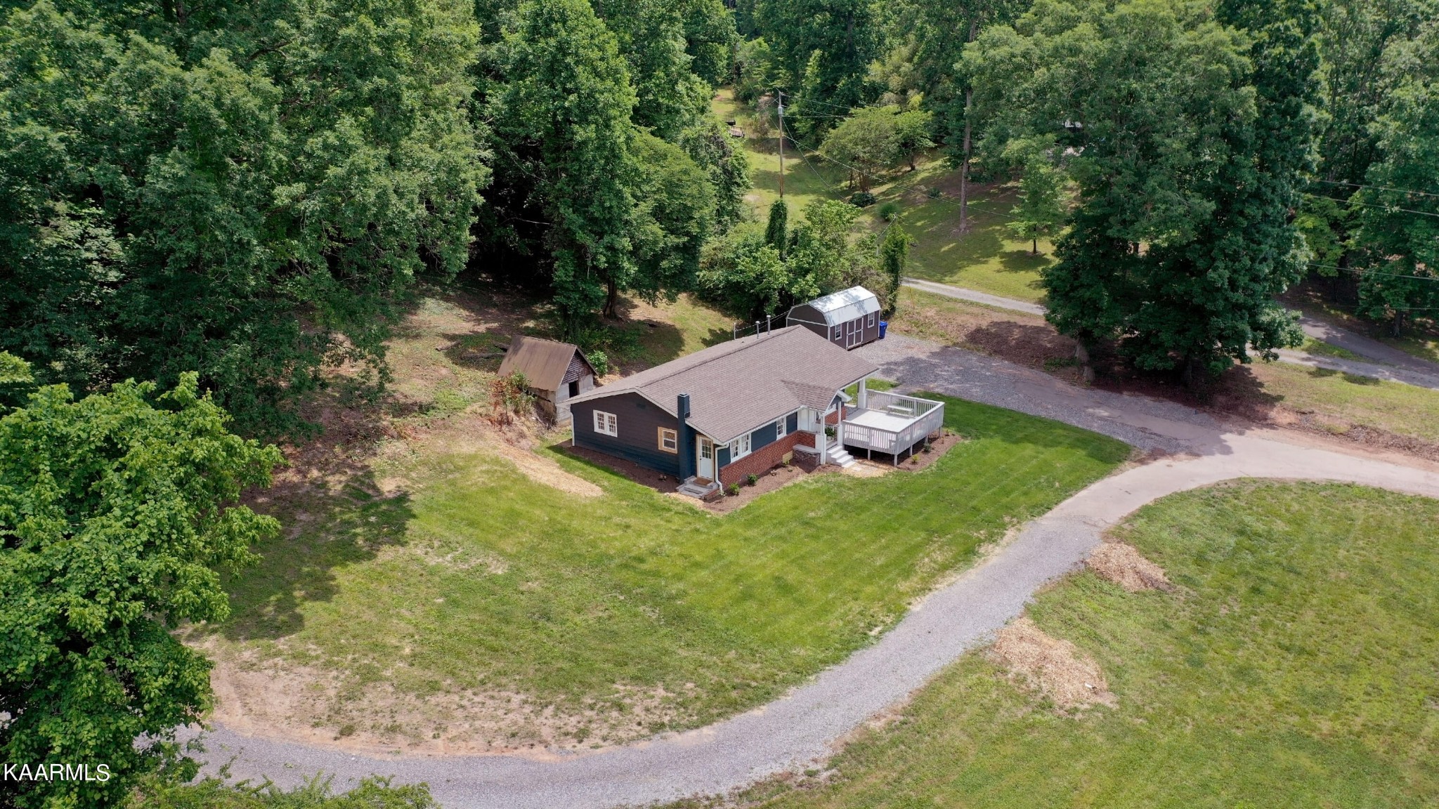 679 Blockhouse Valley Road Clinton, TN 37716 - Photo 6 of 45 a view of a backyard with of water