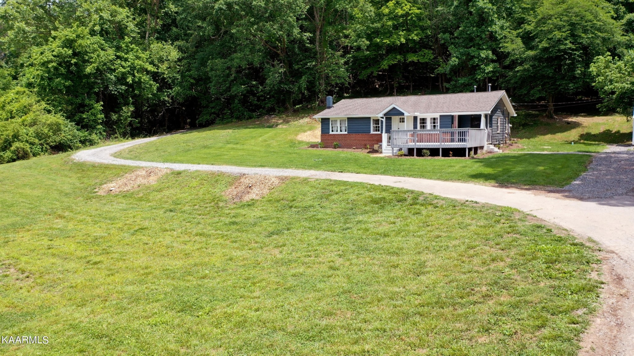 679 Blockhouse Valley Road Clinton, TN 37716 - Photo 10 of 45 a view of an house with swimming pool and yard