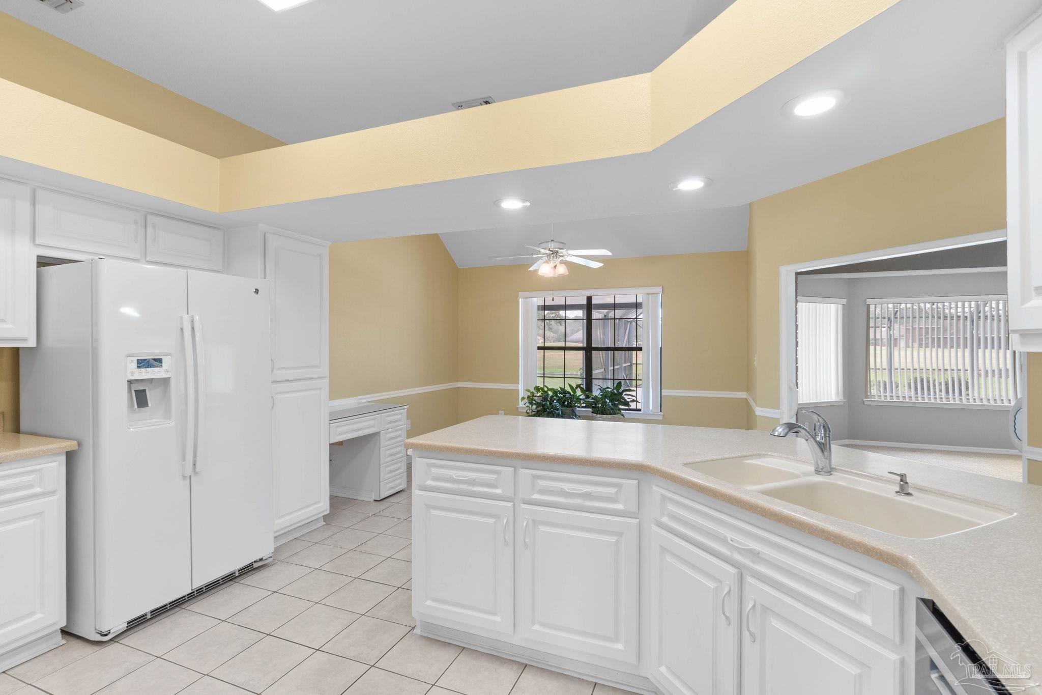 2640 Masters Boulevard Navarre, FL 32566 - Photo 14 of 40 a bathroom with a sink double vanity and a bathtub