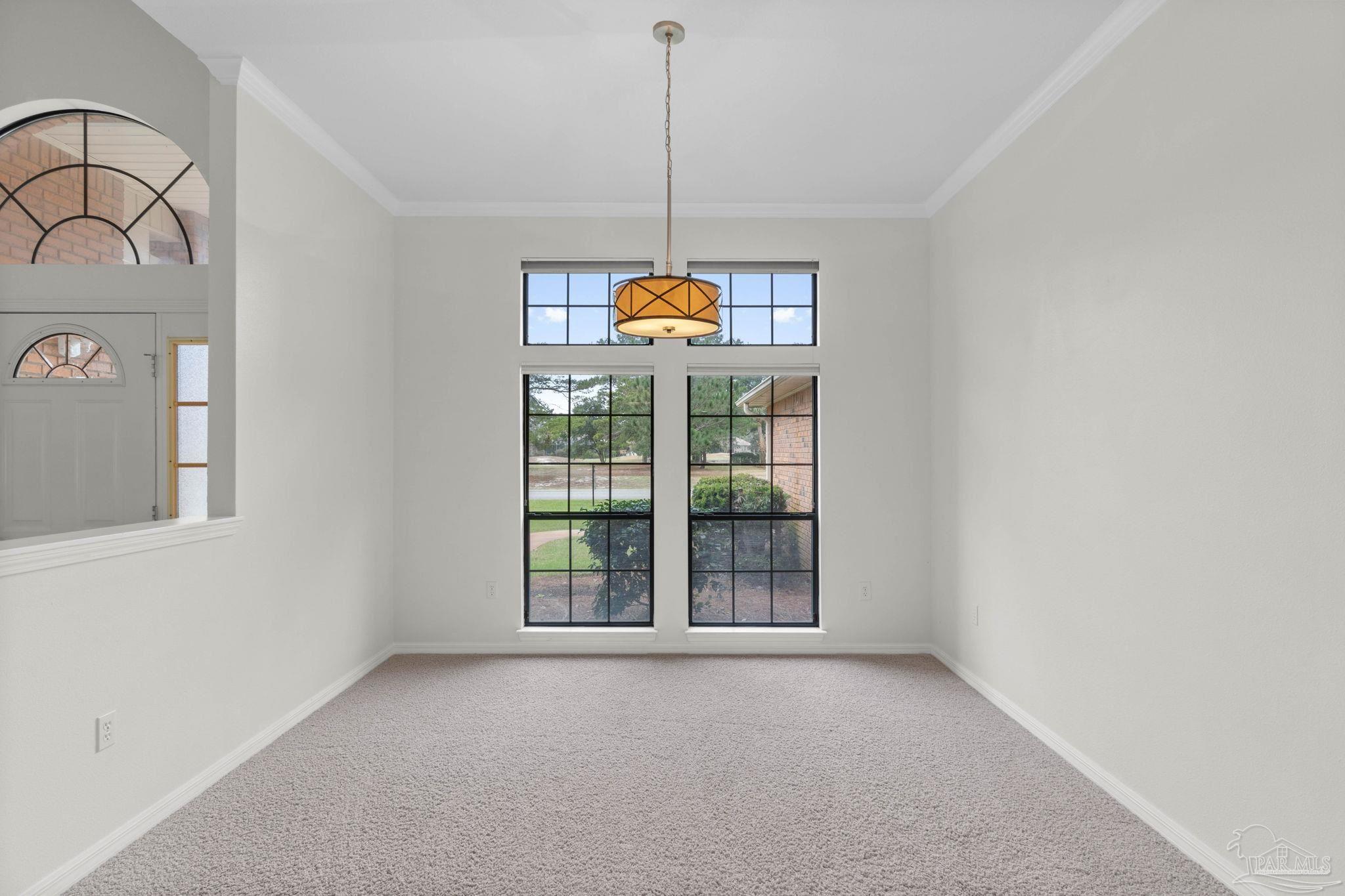 2640 Masters Boulevard Navarre, FL 32566 - Photo 5 of 40 a workspace room with windows