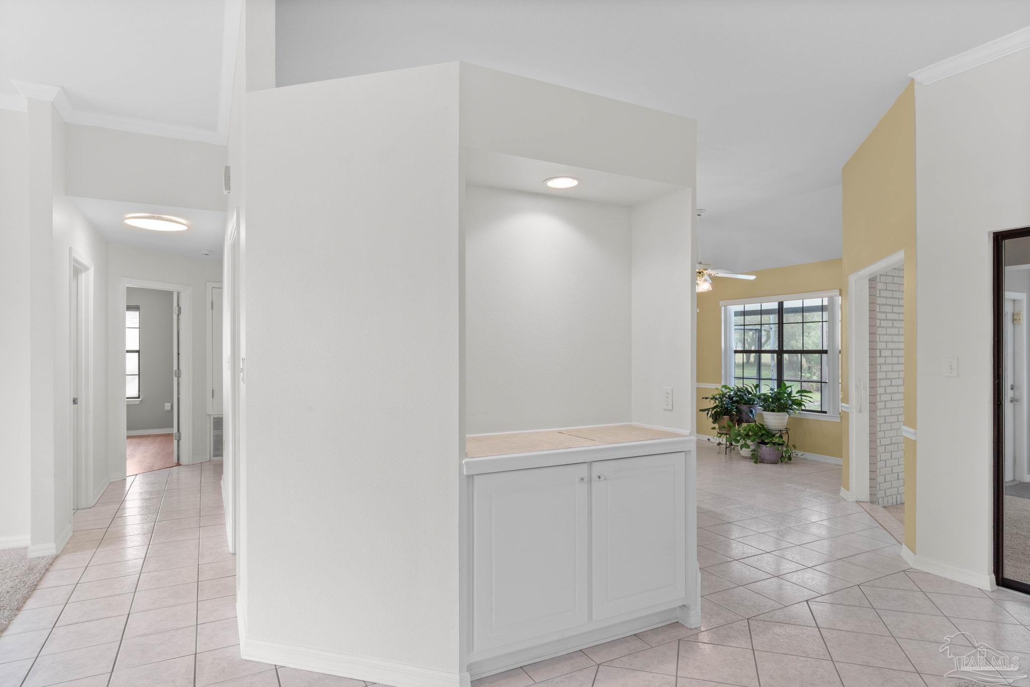 2640 Masters Boulevard Navarre, FL 32566 - Photo 10 of 40 a view of an entryway and kitchen view