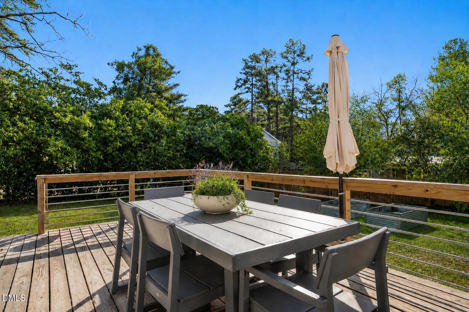 5904 Volant Drive Raleigh, NC 27609 - Photo 37 of 42 a view of city from a roof deck with wooden floor and seating space