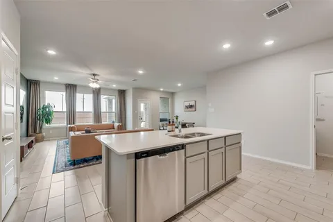 a kitchen with sink and stove