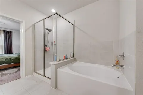 a bathroom with a bathtub and a shower