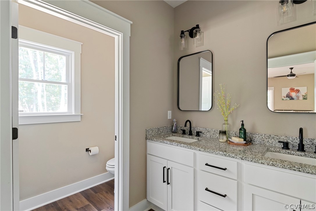 180 Goodwin Store Road Louisa, VA 23093 - Photo 18 of 27 a bathroom with 2 sink and a mirror