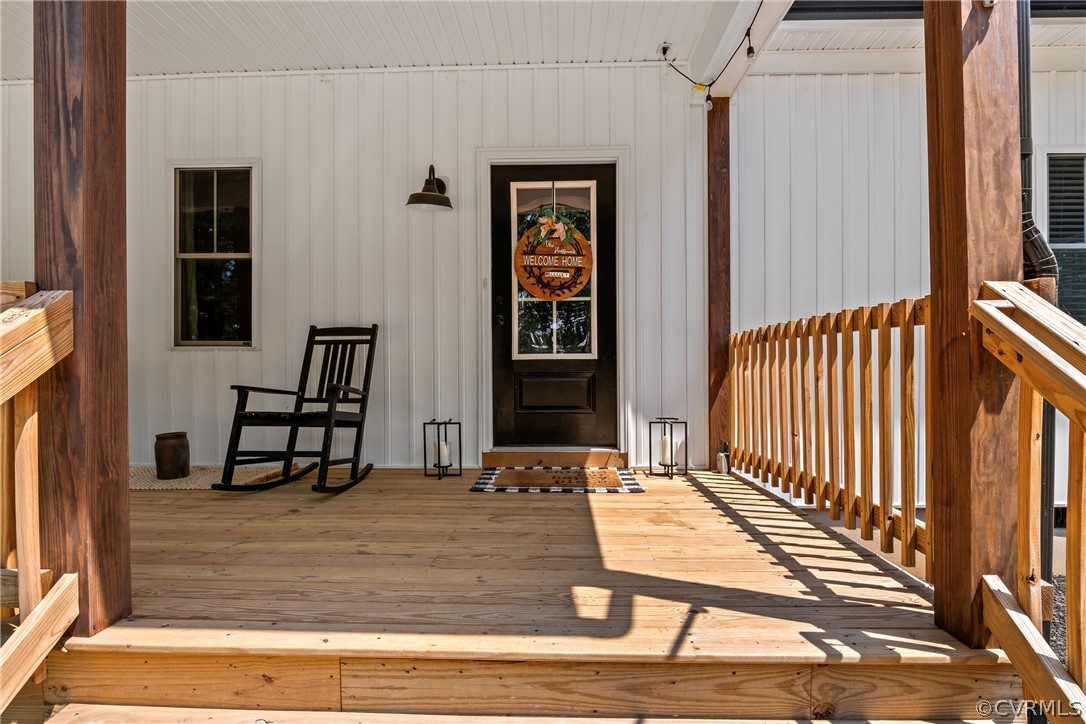 180 Goodwin Store Road Louisa, VA 23093 - Photo 3 of 27 a view of a balcony with chair and front door