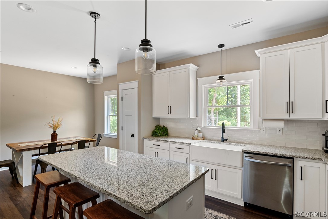 180 Goodwin Store Road Louisa, VA 23093 - Photo 7 of 27 a kitchen with stainless steel appliances granite countertop a sink a stove and a center island