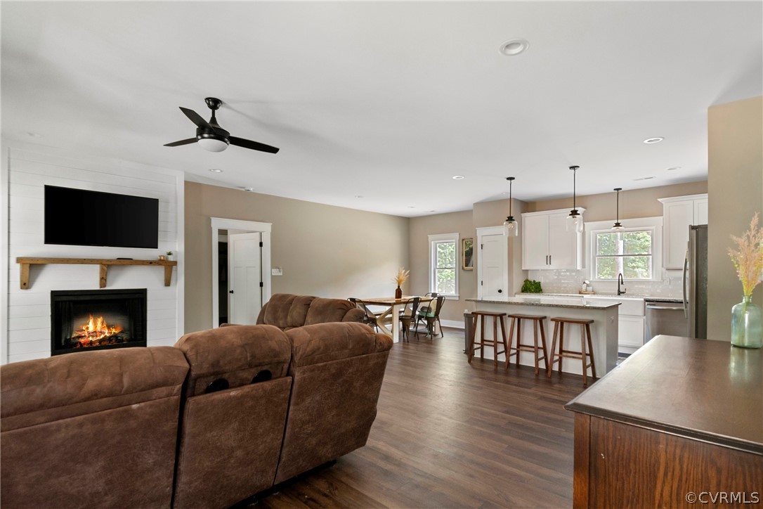 180 Goodwin Store Road Louisa, VA 23093 - Photo 8 of 27 a living room with furniture fireplace and a flat screen tv