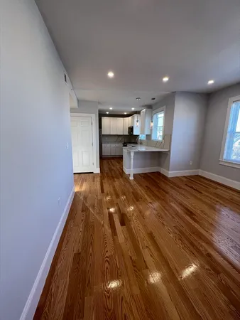 a view of kitchen and dining room with wooden floor