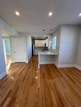 a view of kitchen and wooden floor