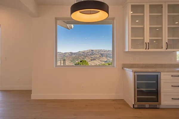 a kitchen with stainless steel appliances a refrigerator a sink and a stove